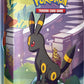 Pokemon TCG: Scarlet & Violet —Prismatic Evolutions Mini Tin - Umbreon (2 Booster Packs & 1 Coin)